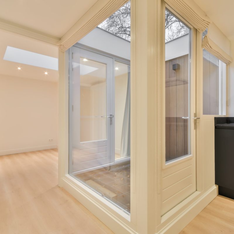 Smoking room located in the house with panoramic windows and doors